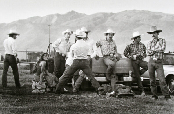 A group of men in cowboy hats and white shirts.