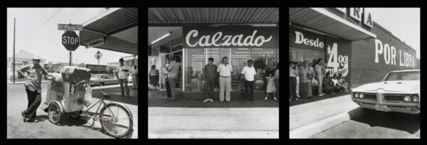 A group of people standing in front of a store.