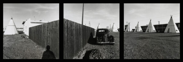 A black and white photo of an old car.