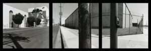 A black and white photo of a train track