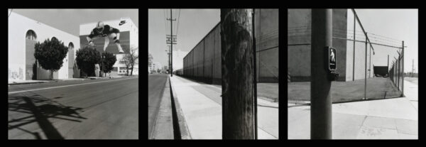 A black and white photo of a train track