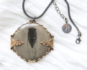 A necklace with a picture of a dog on it.