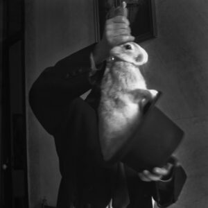 A person holding an animal in their arms.