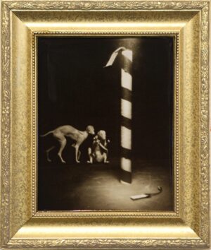 A painting of two dogs and a cat in a gold frame.