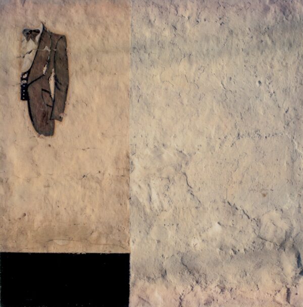 A shoe hanging on the wall of a room.