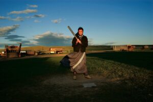 A man holding a baseball bat in his hands.