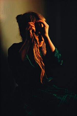 A woman holding onto some long hair