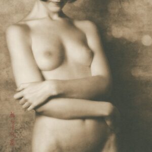A woman with her arms crossed in front of the camera.