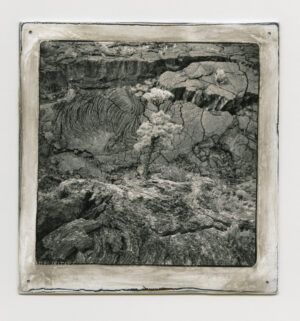 A black and white photo of a person in the water.