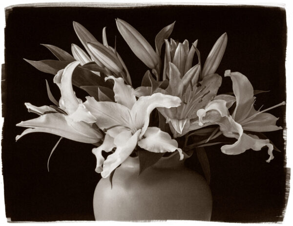 A vase filled with flowers on top of a table.