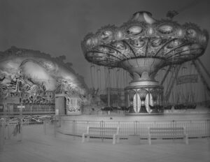 A black and white photo of a carousel.