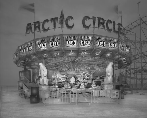 A black and white photo of an amusement park.