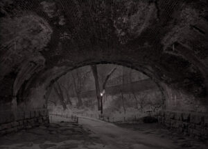 A dark picture of an underground tunnel.