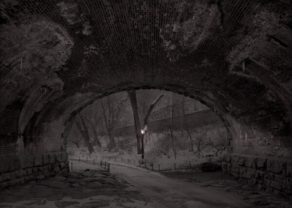 A dark picture of an underground tunnel.
