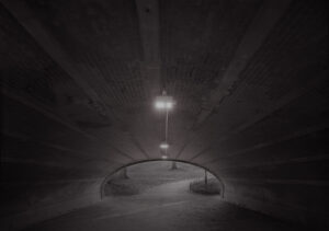 A light in the middle of an empty tunnel.