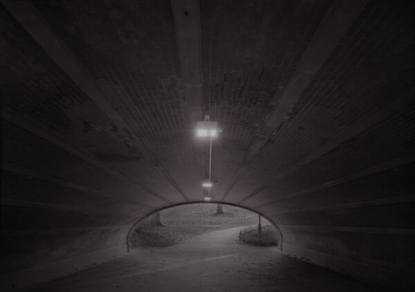 A light in the middle of an empty tunnel.