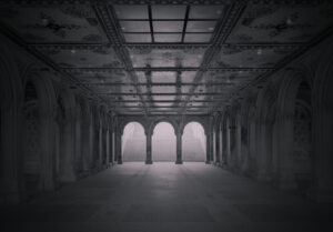 A large empty room with arches and pillars.