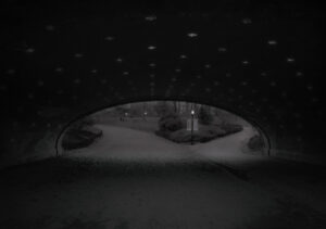 A black and white photo of an underpass.