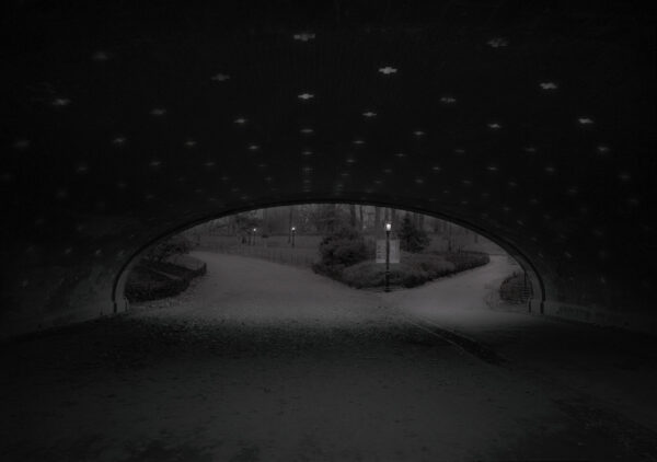 A black and white photo of an underpass.