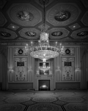 A chandelier in the middle of a room.