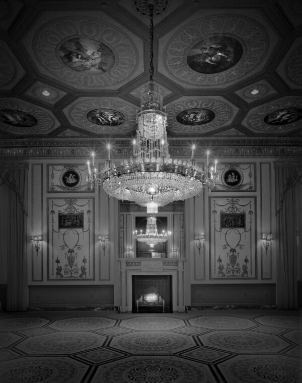 A chandelier in the middle of a room.