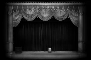 A stage with curtains and drapes on it