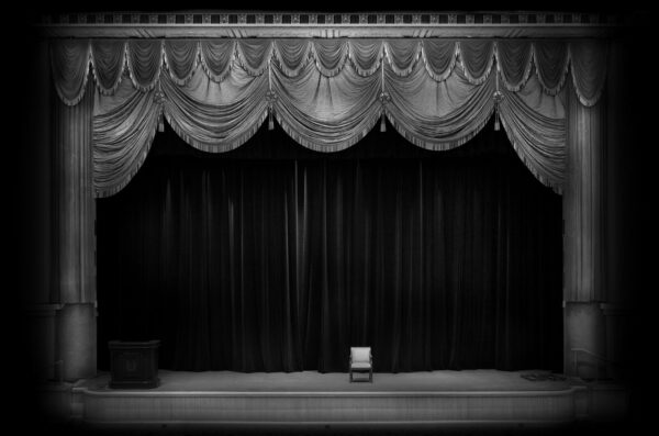 A stage with curtains and drapes on it