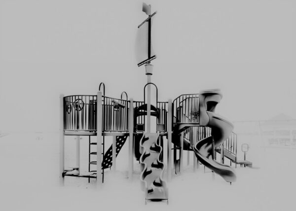 A black and white photo of a playground.