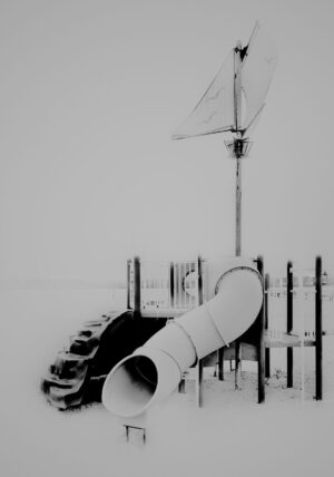 A black and white photo of a playground.
