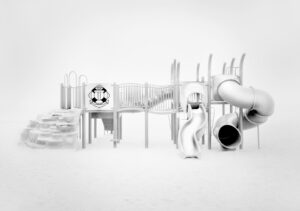 A playground with slides and a tunnel.