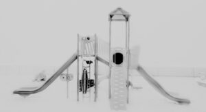 A black and white photo of some slides on the ground.
