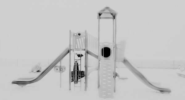 A black and white photo of some slides on the ground.