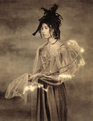 A woman with dreadlocks in a dress