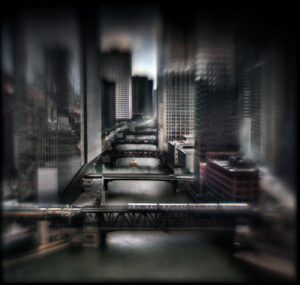 A blurry photo of some buildings and water