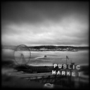 A black and white photo of the public market.