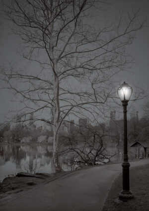 A lamp post with a street light on it