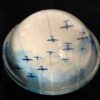 A bowl with airplanes flying in the sky.