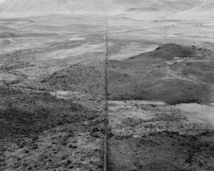 A black and white photo of the desert.
