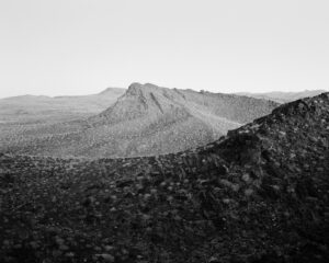 A black and white photo of some mountains