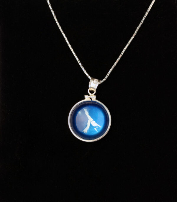 A blue necklace with a picture of a clock.