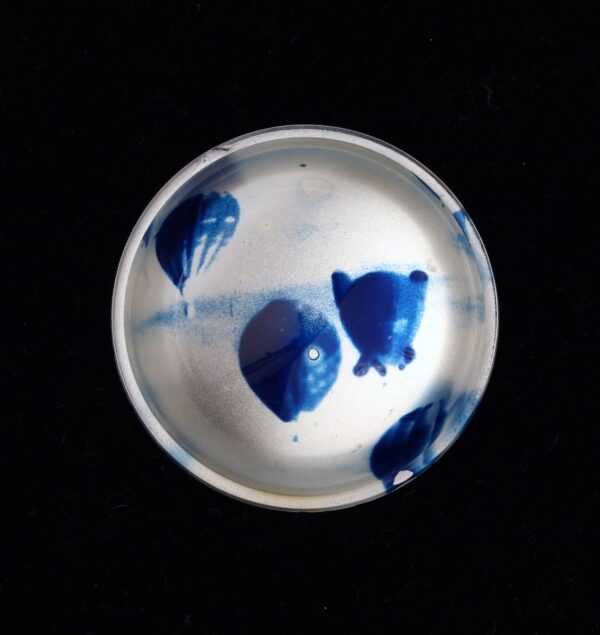 A bowl with blue paint on it