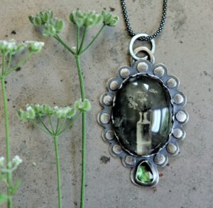 A necklace with a picture of a person in it