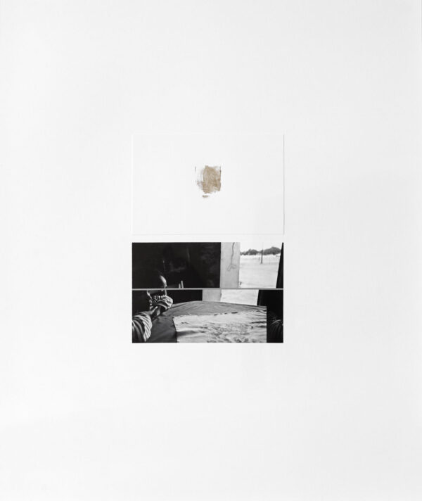 A black and white photo of a room with a clock on the wall.