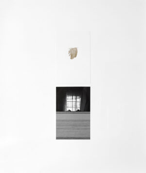 A white wall with a window and a light hanging from it.