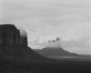 A black and white photo of some mountains