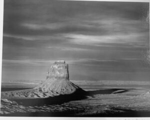 A black and white photo of a desert landscape.