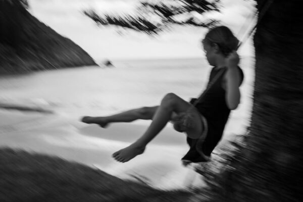 A person is jumping in the air on a surfboard.