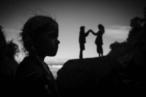 A black and white photo of two people shaking hands
