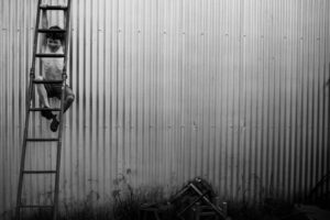 A black and white photo of a metal wall.