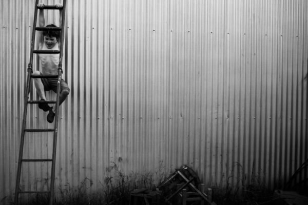 A black and white photo of a metal wall.